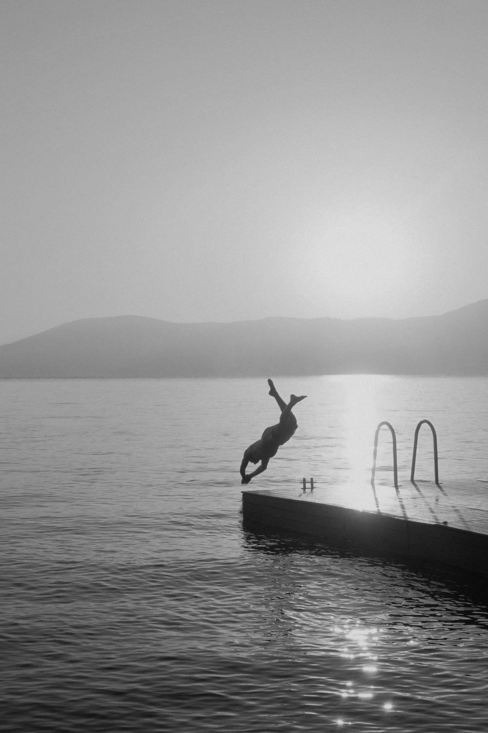 Photo of a man diving into a swimming pool